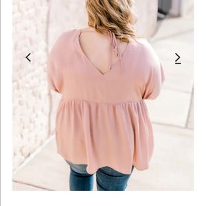 This super cute blush blouse is flowy and goes with anything!